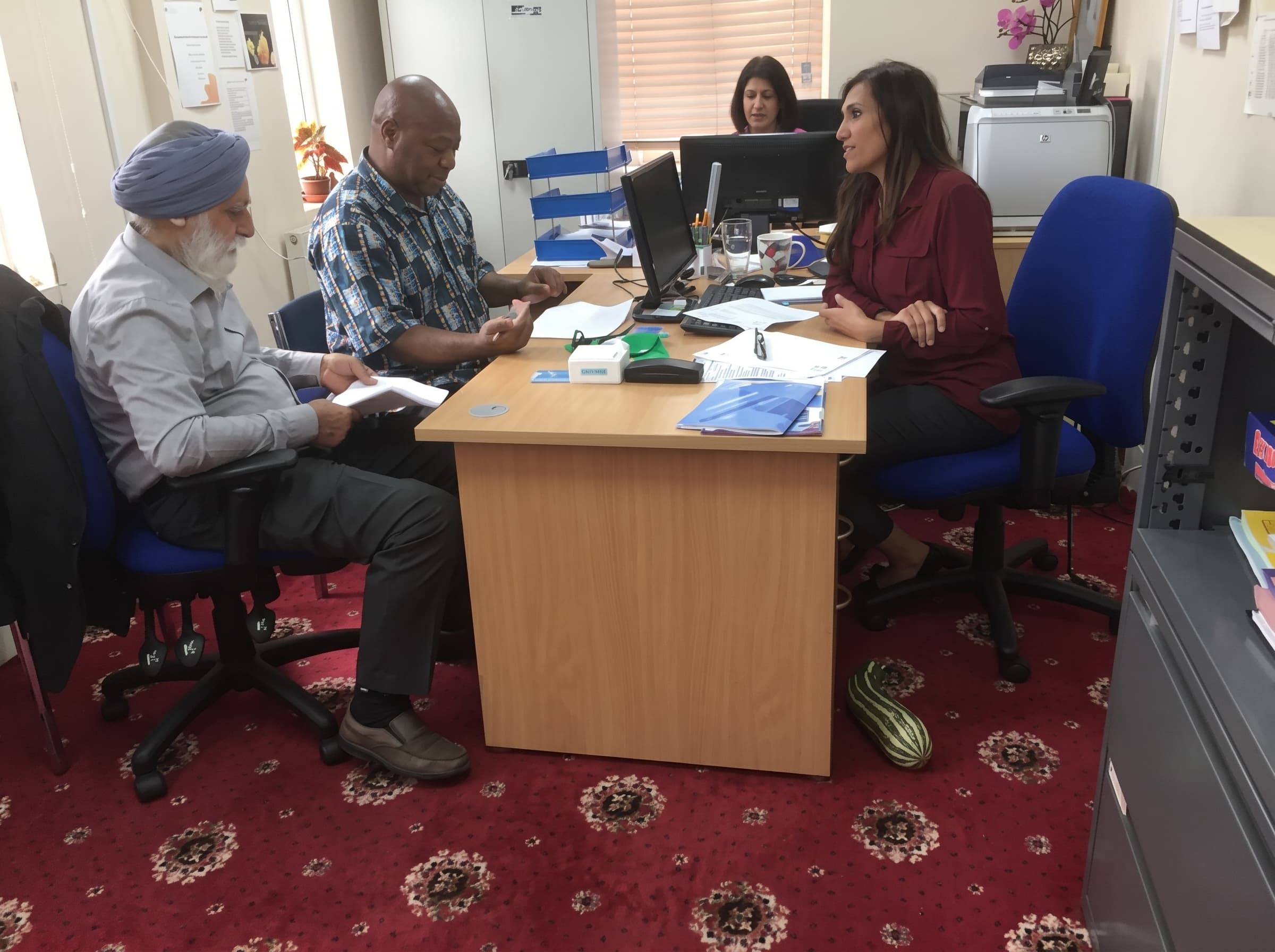Community organisation leadership team reviewing their funding strategy
